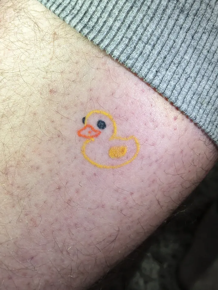 Yellow rubber duck on the leg