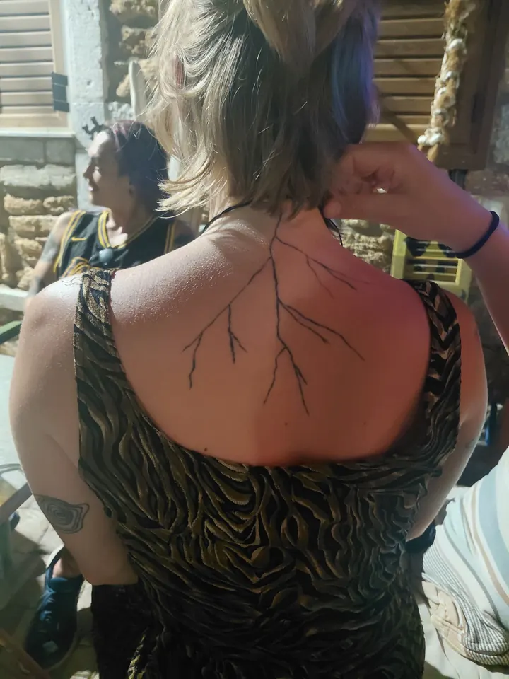 Cover-up, before: thin branching lines on the upper back