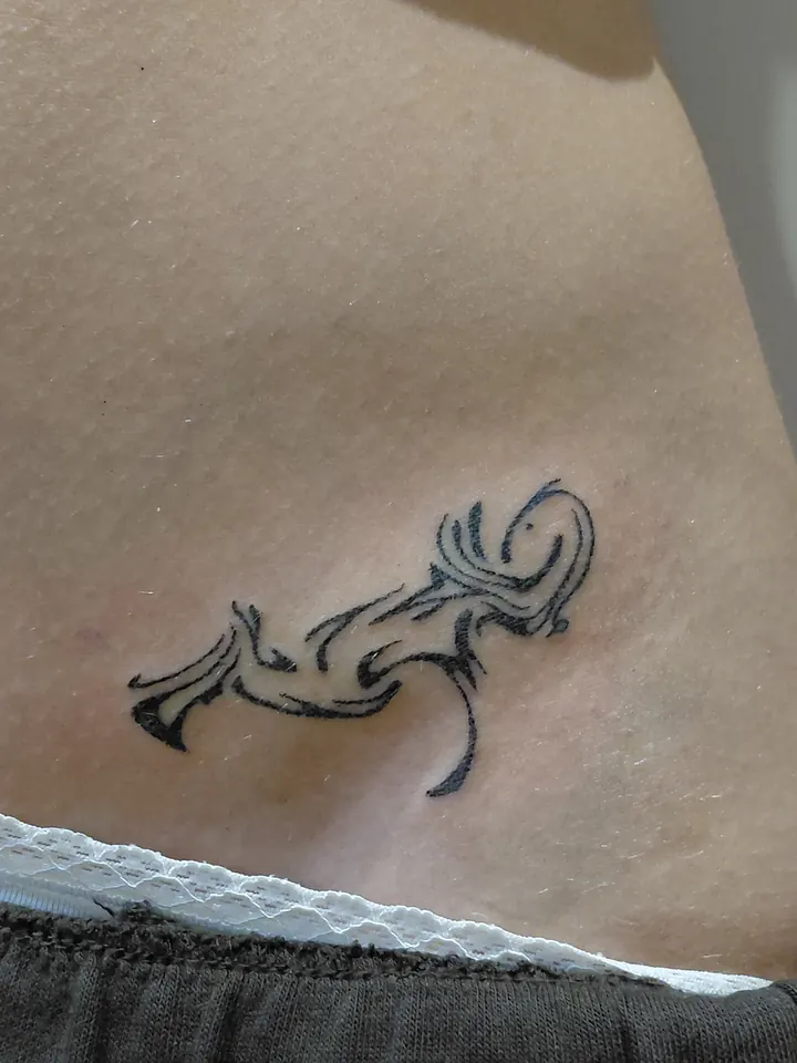 Matching abstract design on the hip, the other of the pair