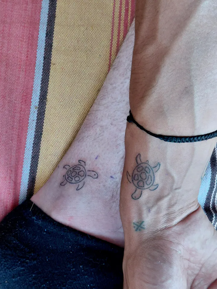 Matching sea turtles on two ankles