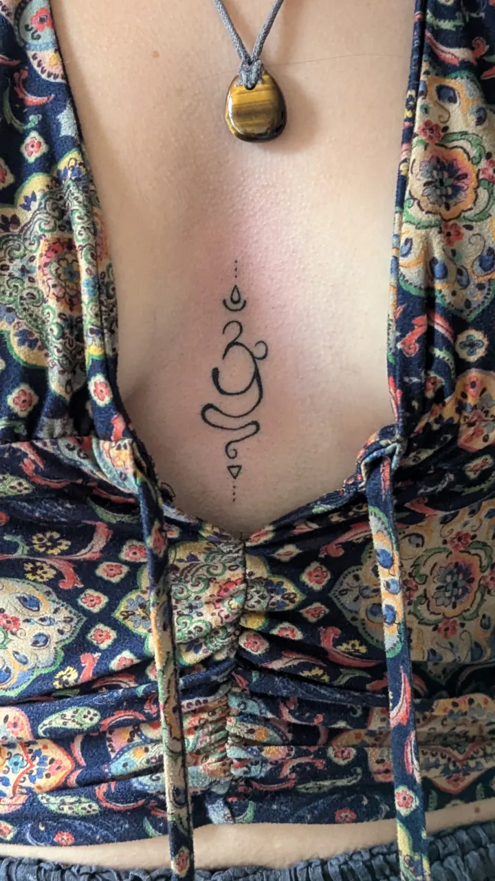 Unalome symbol on the sternum