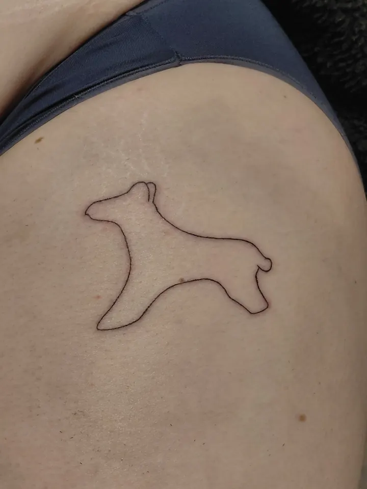 Outline of a dog on the hip