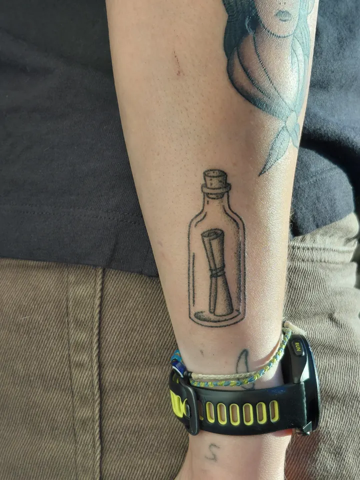 Message in a bottle on the lower leg
