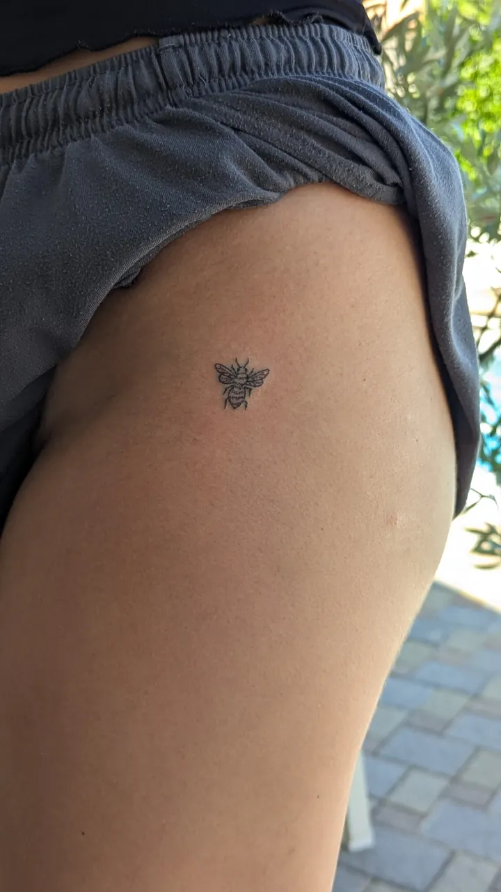 Tiny bee on the thigh
