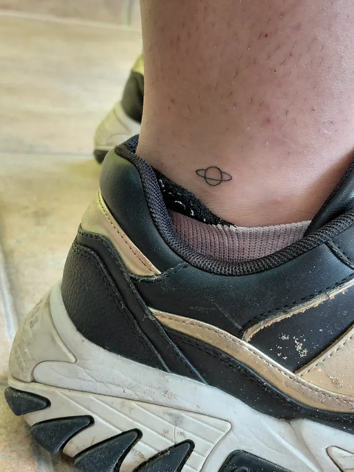 Tiny ringed planet on the ankle